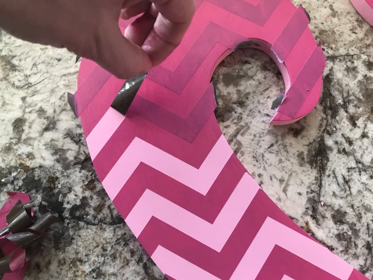 Make your own valentine door hanger with this free funky heart svg file. It works with Cricut, Silhouette, and other digital cutters