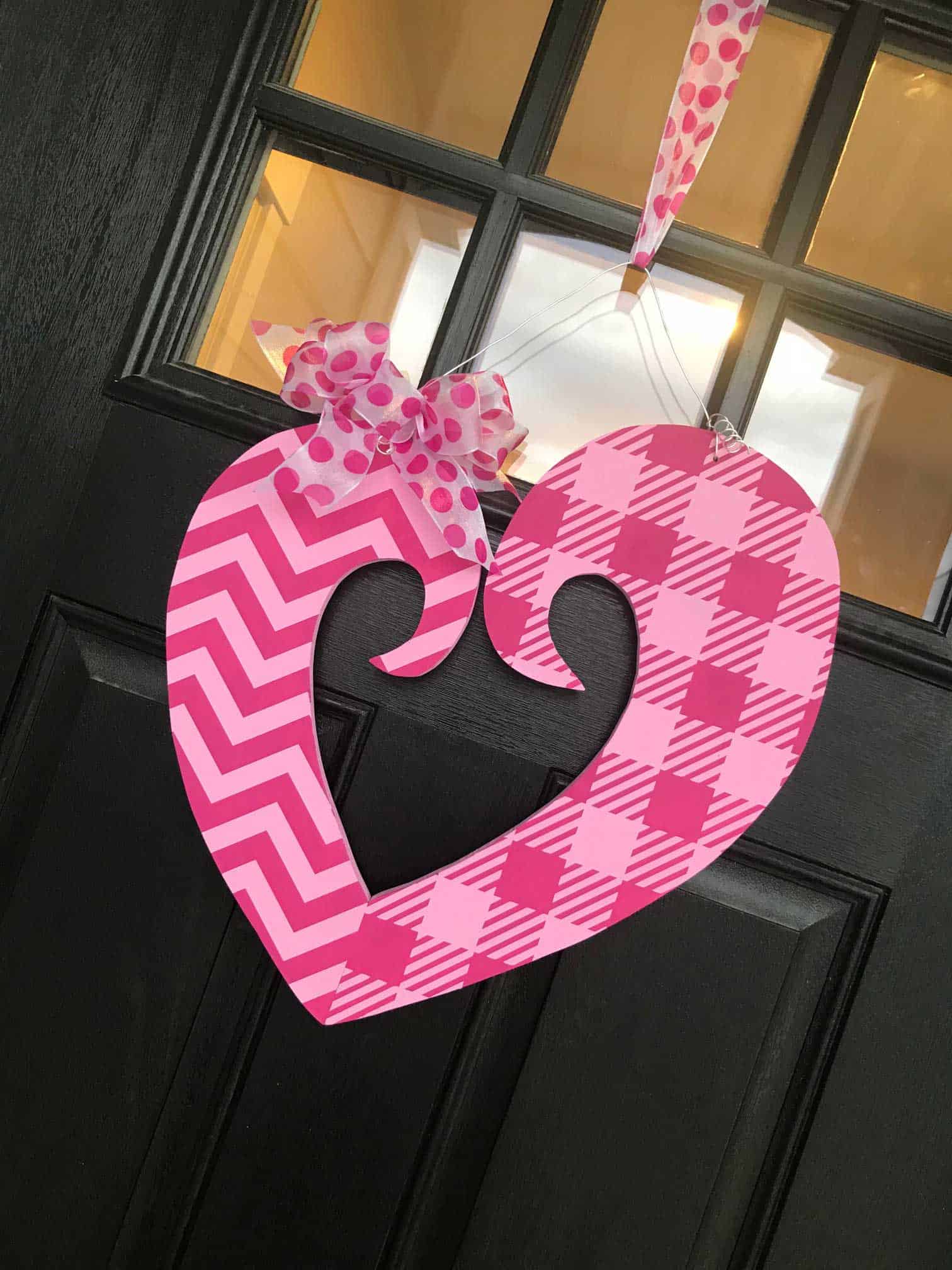 Make your own valentine door hanger with this free funky heart svg file. It works with Cricut, Silhouette, and other digital cutters