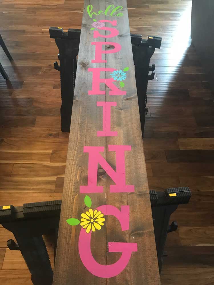 Make this cute DIY Spring Porch sign with your Cricut or Silhouette cutter. Free Hello Spring SVG file.