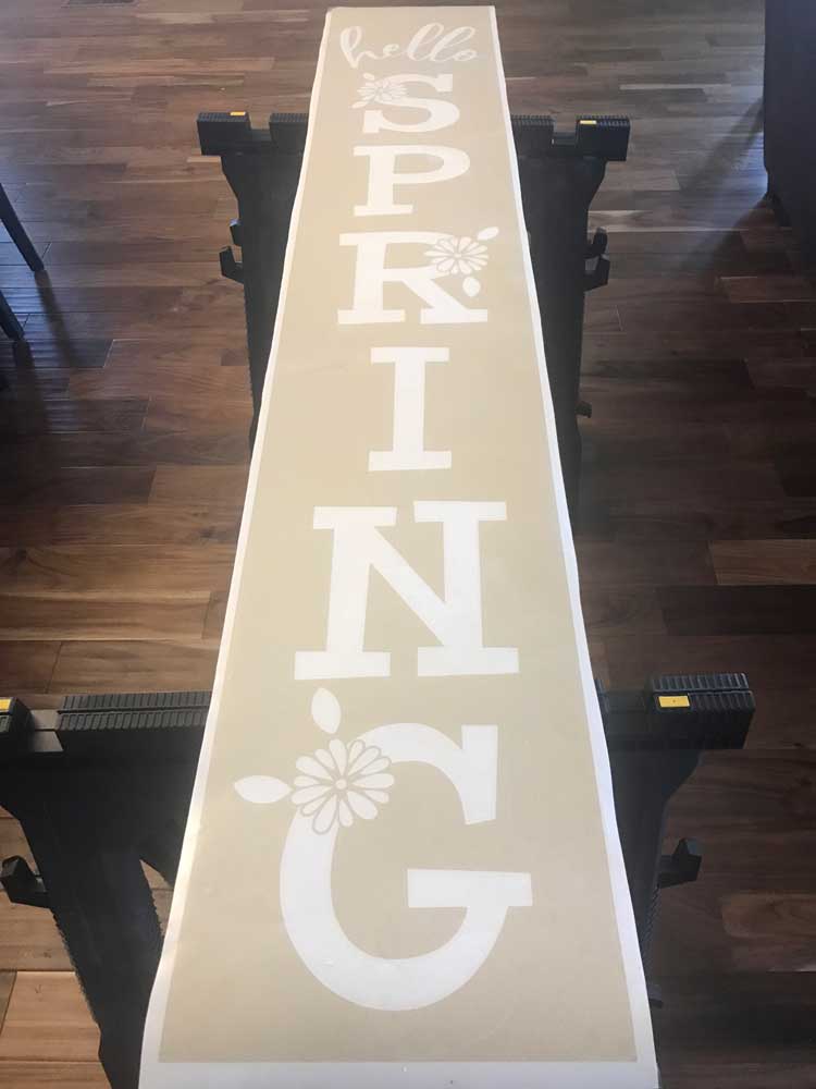 Make this cute DIY Spring Porch sign with your Cricut or Silhouette cutter. Free Hello Spring SVG file.