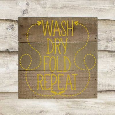 Download this free Wash Dry Fold Repeat SVG file for your DIY Laundry Room projects. This free SVG file will work Cricut and Silhouette cutters.