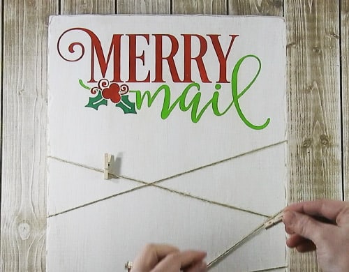 Create a place to display your Christmas Cards with this easy to follow tutorial. With a few supplies and you Silhouette or Cricut machine, you be able to create this cut Christmas Card holder for your home. This DIY project is easy and quick to make and is the perfect decoration for home. #ChristmasSilhouette #ChristmasCricut #ChristmasSVG #ChristmasCardholder