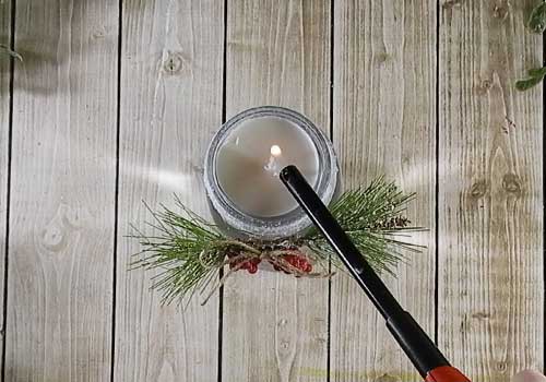 Make this cute pretty etched holiday candle holer with this easy to follow tutorial. With a few supplies and your Silhouette or Cricut machine, you'll be able to create this etched holiday candle for your home. This DIY project is easy and quick to make and is the perfect decoration for home. #ChristmasSilhouette #ChristmasCricut #ChristmasSVG