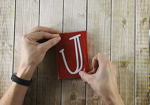 Make this darling Christmas sign with this easy to follow tutorial. With a few supplies and your Silhouette or Cricut machine, you'll be able to create this hinged Christmas block sign for your home home. This DIY project is easy and quick to make and is the perfect decoration for home. #ChristmasSilhouette #ChristmasCricut #ChristmasSVG