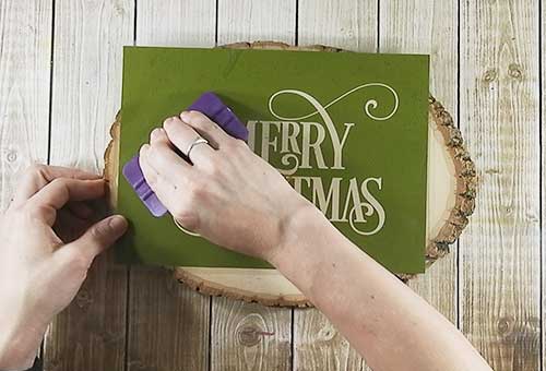 Make your own custom Christmas wood slice with your Silhouette or Cricut machine. This DIY project is easy and quick to make and is the perfect decoration for home. #ChristmasSilhouette #ChristmasCricut #ChristmasSVG #Christmaswoodslice