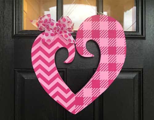 Make your own valentine door hanger with this free funky heart svg file. It works with Cricut, Silhouette, and other digital cutters