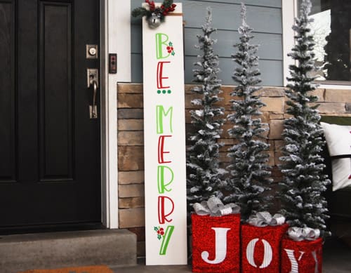 Learn how to make your own Christmas Porch Sign with this easy to follow tutorial. With a few tools and your Silhouette or Cricut machine, you'll be able to create this Christmas Porch Sign for your home.. This DIY project is easy and quick to make and is the perfect decoration for you Christmas porch. #ChristmasSilhouette #ChristmasCricut #ChristmasSVG