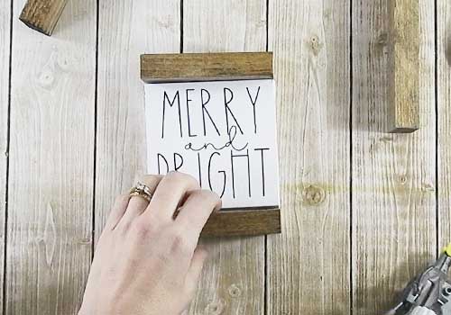 Make these adorable mini signs for Christmas sign with this easy to follow tutorial. With a few supplies and your Silhouette or Cricut machine, you'll be able to create these frame canvas Christmas signs for your home. This DIY project is easy and quick to make and is the perfect decoration for home. #ChristmasSilhouette #ChristmasCricut #ChristmasSVG