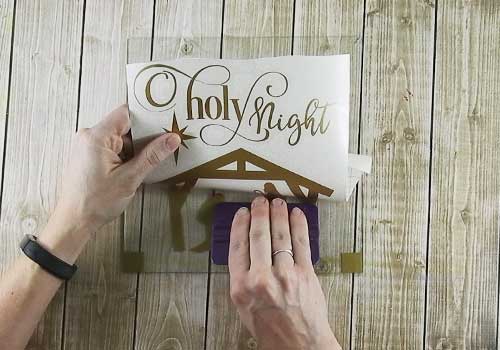 Make this Lighted Christmas shadow box sign with this easy to follow tutorial. With a few supplies and your Silhouette or Cricut machine, you'll be able to create this Lighted Christmas Shadow Box for your home home. This DIY project is easy and quick to make and is the perfect decoration for home. #ChristmasSilhouette #ChristmasCricut #ChristmasSVG