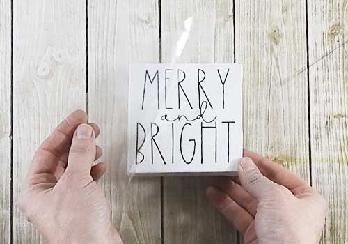 Make these adorable adorable mini signs for Christmas sign with this easy to follow tutorial. With a few supplies and your Silhouette or Cricut machine, you'll be able to create these frame canvas Christmas signs for your home. This DIY project is easy and quick to make and is the perfect decoration for home. #ChristmasSilhouette #ChristmasCricut #ChristmasSVG