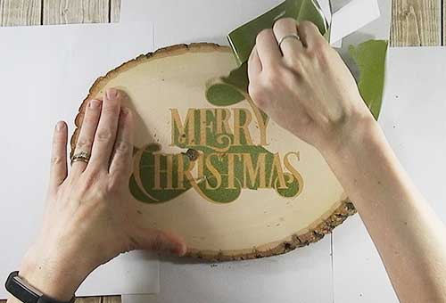 Make your own custom Christmas wood slice with your Silhouette or Cricut machine. This DIY project is easy and quick to make and is the perfect decoration for home. #ChristmasSilhouette #ChristmasCricut #ChristmasSVG #Christmaswoodslice