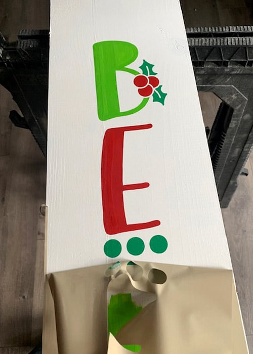 Learn how to make your own Christmas Porch Sign with this easy to follow tutorial. With a few tools and your Silhouette or Cricut machine, you'll be able to create this Christmas Porch Sign for your home.. This DIY project is easy and quick to make and is the perfect decoration for you Christmas porch. #ChristmasSilhouette #ChristmasCricut #ChristmasSVG