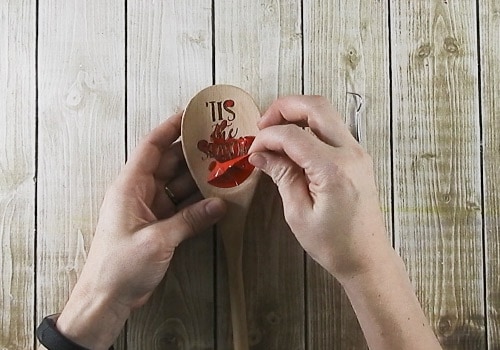 Learn how to make your own wood burned Christmas spoons with this easy to follow tutorial. With a few tools and your Silhouette or Cricut machine, you'll be able to create these cute wood burned Christmas spoons for your home or as gifts. This DIY project is easy and quick to make and is the perfect gift for family and friends. #ChristmasSilhouette #ChristmasCricut #ChristmasSVG