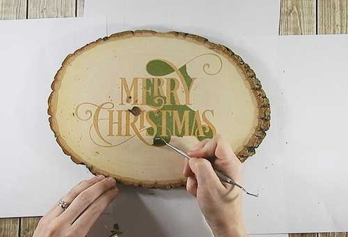 Make your own custom Christmas wood slice with your Silhouette or Cricut machine. This DIY project is easy and quick to make and is the perfect decoration for home. #ChristmasSilhouette #ChristmasCricut #ChristmasSVG #Christmaswoodslice